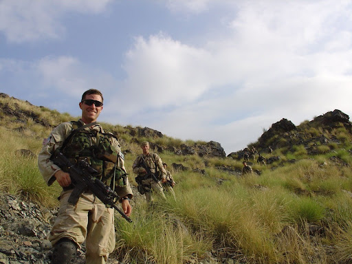 Jason Crow in his military uniform on a mountainside